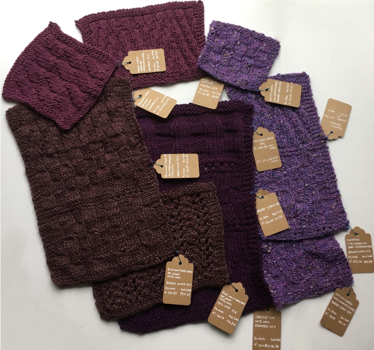 photo of a number of knitted rectangle swatches in different patterns