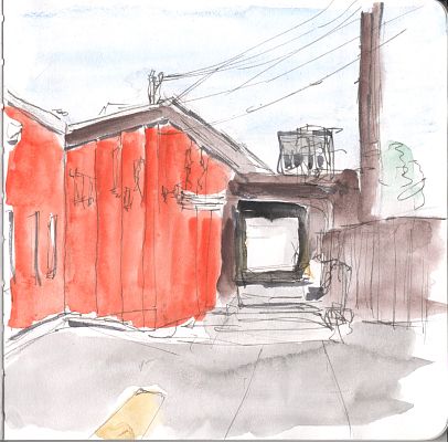 An ink and watercolor sketch of a loading dock in the back of a building with orange walls.