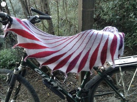 photo of a shawl draped over a mountain bicycle