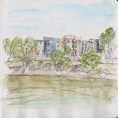 An ink, colored pencil, and watercolor sketch of a series of apartment buildings behind some trees that are growing on the bank of a greenish river in the lower part of the drawing.