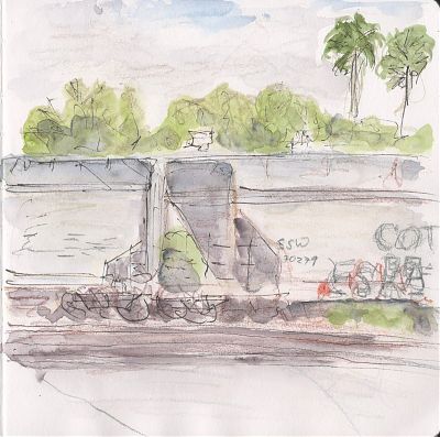 A line and wash sketch of portions of two railroad cars with a line of trees in the background including two palms.