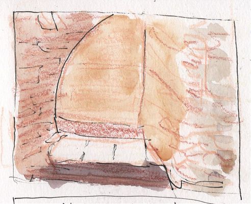 A line and wash sketch in yellow ochre and muted pink of the view down into a chamber with a stone bench at its bottom 